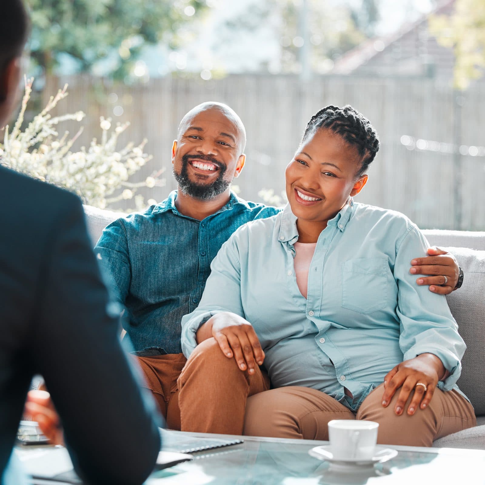 A couple in conversation with an adviser.